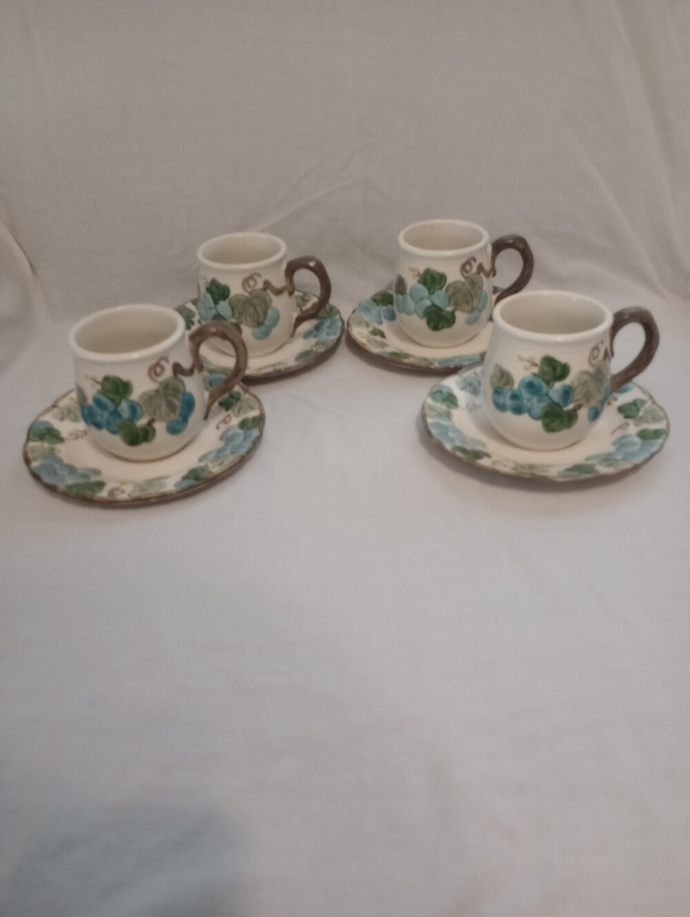 Metlox Poppytrail Sculptured Grape Pattern Mug and Saucer Set - Set Of 4